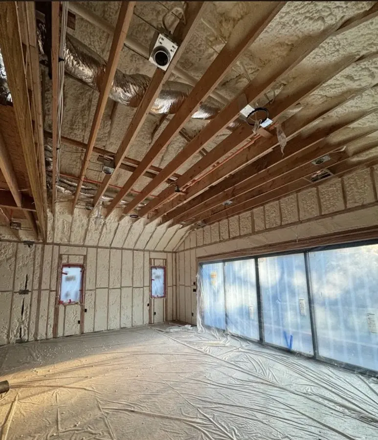 Interior walls and ceiling insulated with spray foam during new construction in Longwood